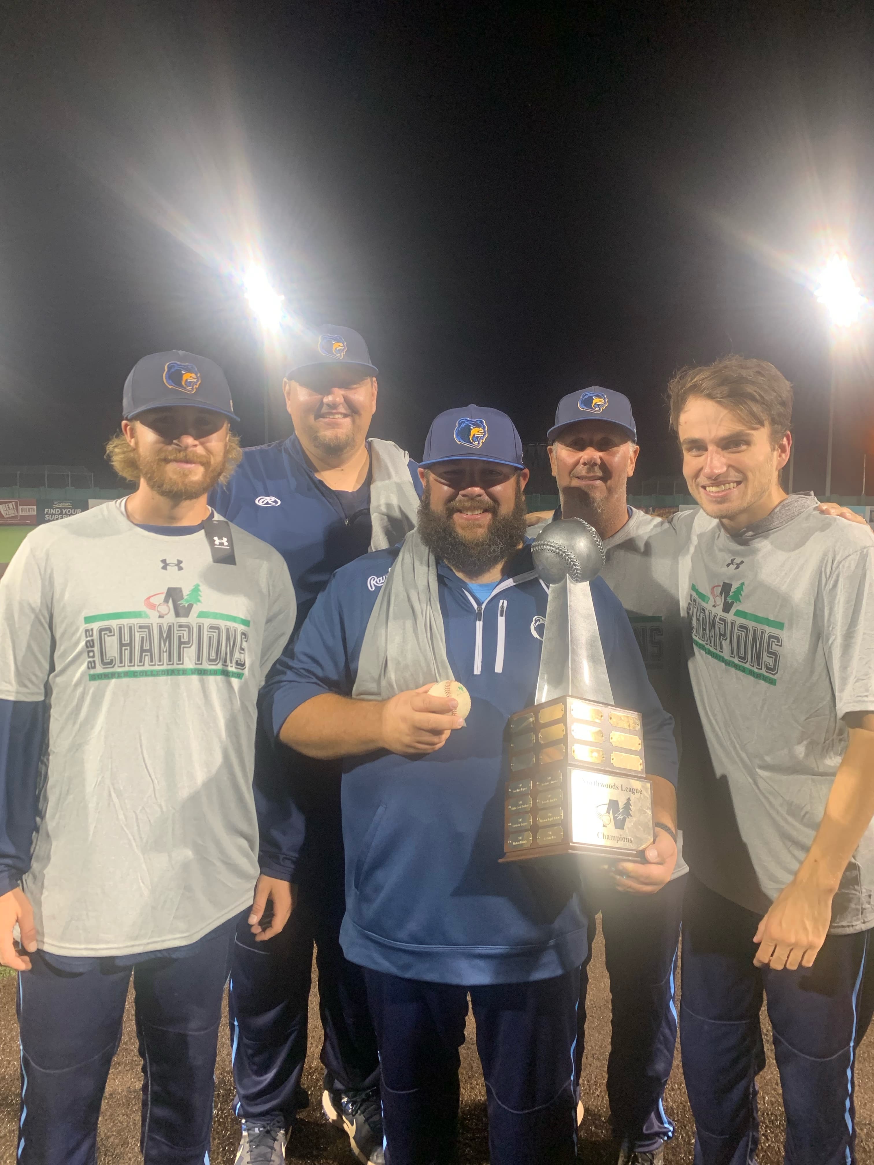 2022 NWL Championship - coaching staff with trophy
