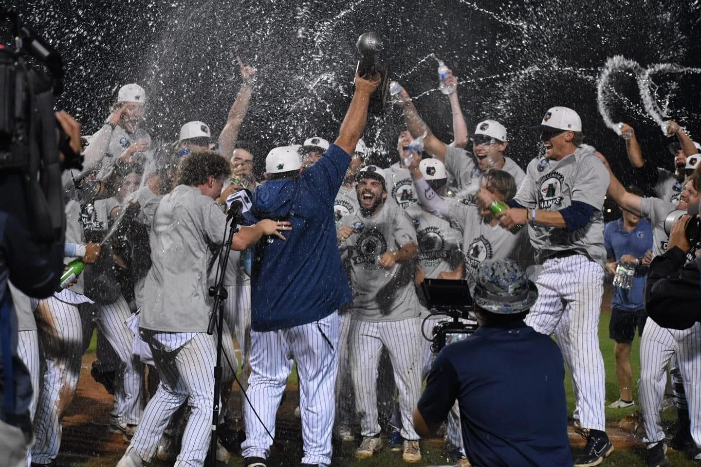 Coach Piechocki lifting the 2024 NWL Championship trophy